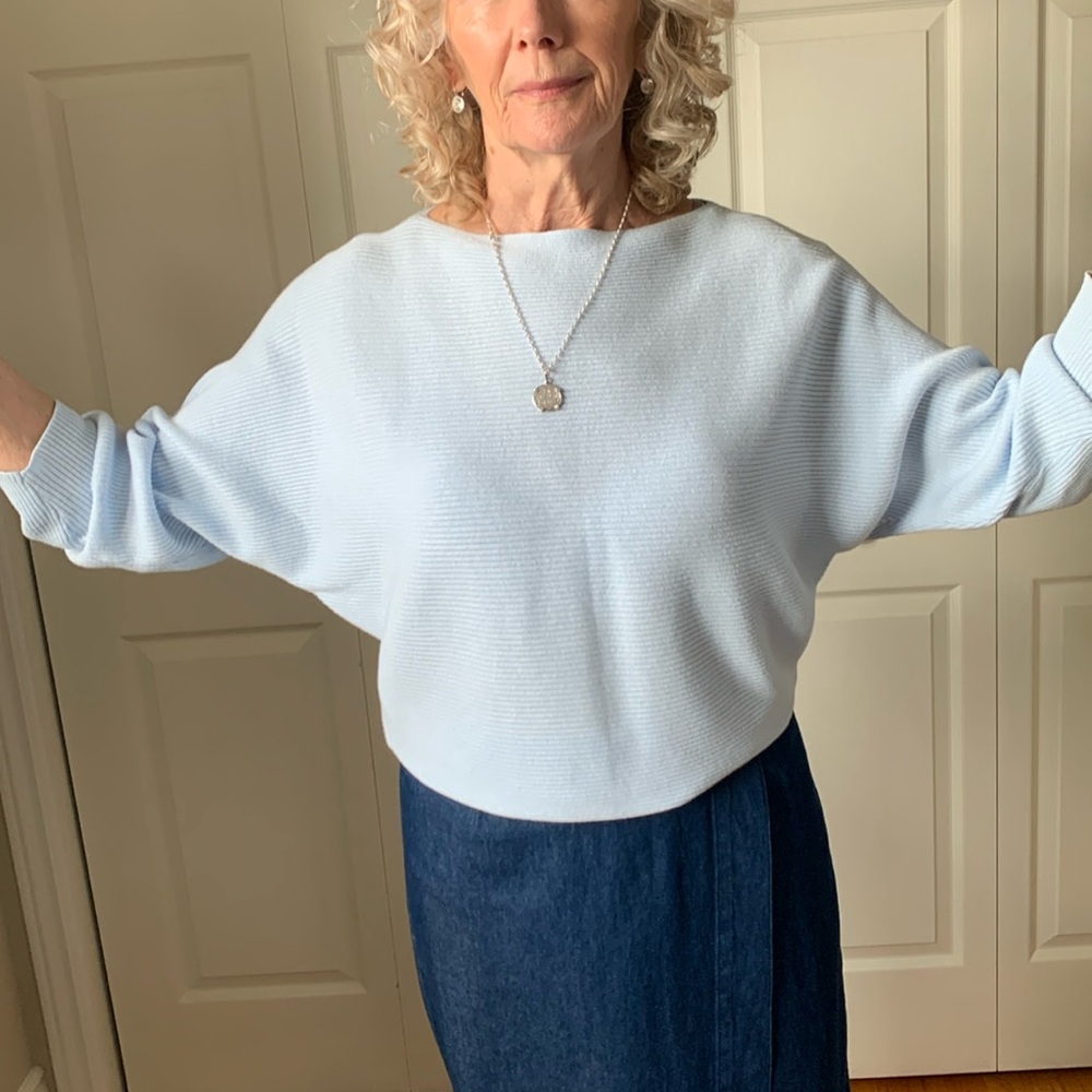 Women’s long sleeve sweater in baby blue colour.